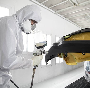 Collision Center Technician Painting a Vehicle | Toyota South in Richmond KY